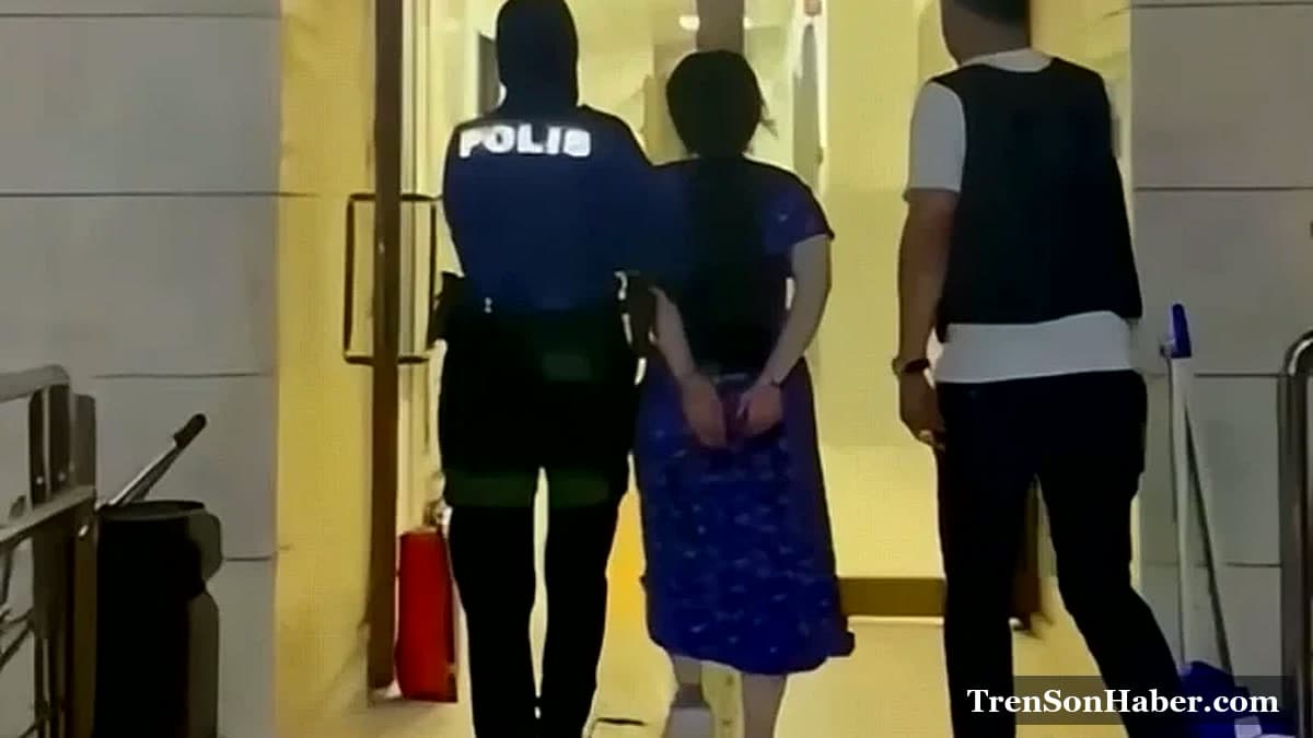 Canlı yayın sırasında düzenlenen polis baskınında gözaltına alınan şüpheli götürülürken