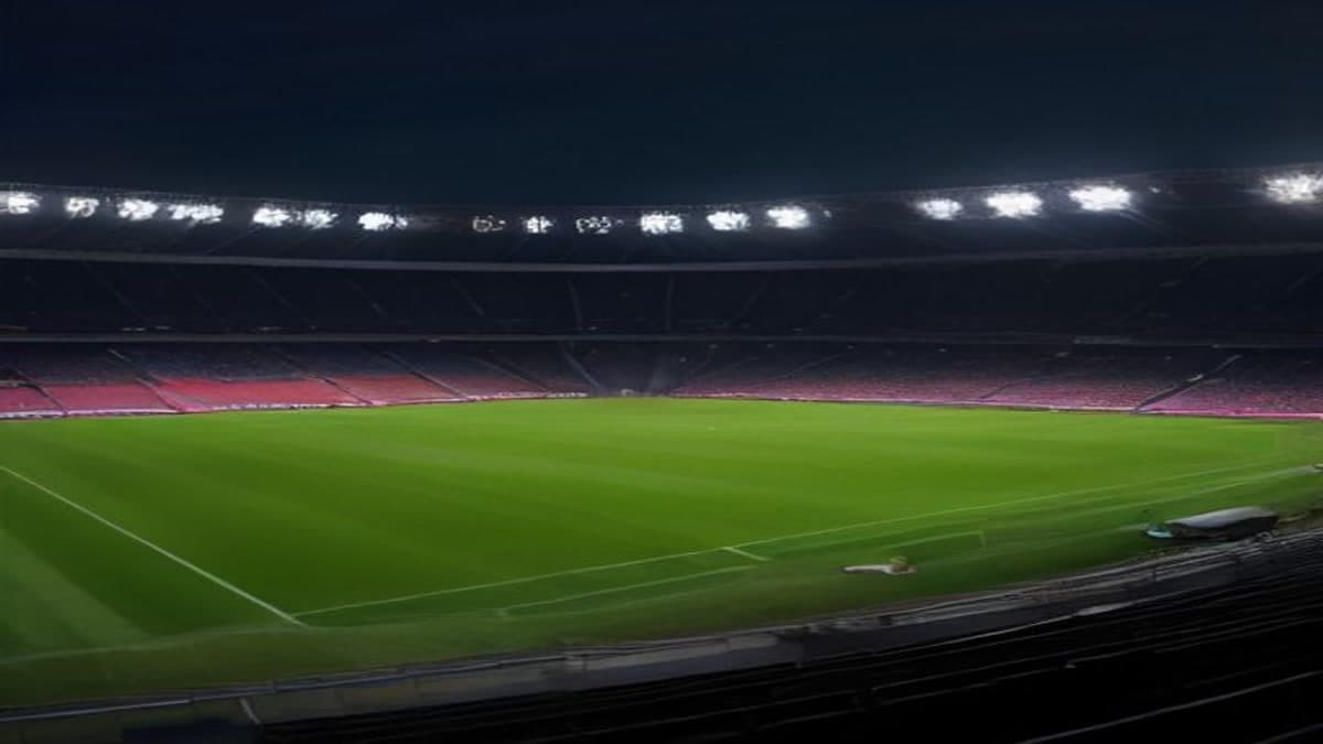 Gece maç öncesi projektörler altında boş futbol stadyumu ve kale ağı (temsilî görsel)