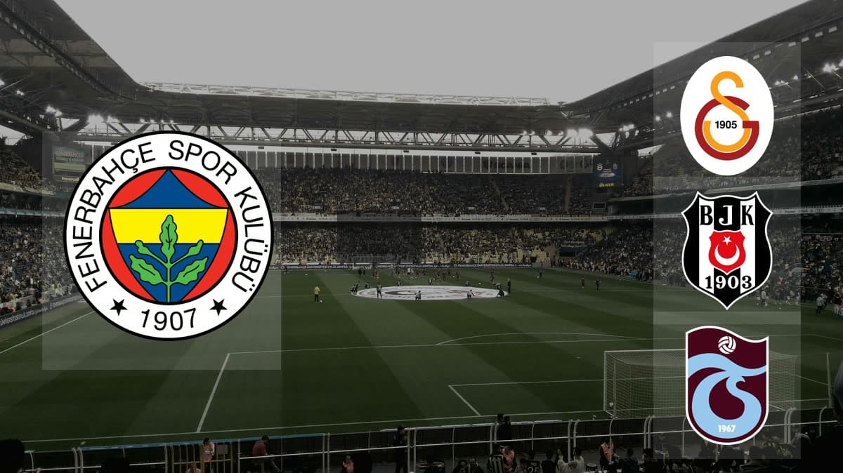 Fenerbahçe amblemi ile Galatasaray, Beşiktaş ve Trabzonspor amblemleri — arka planda Şükrü Saracoğlu (Chobani) Stadyumu